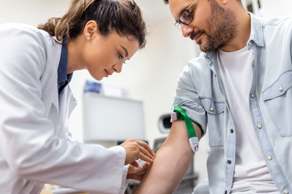 friendly hospital phlebotomist collecting blood sample from patient lab preparation blood test by female doctor medical uniform table white bright room 1024x683 1